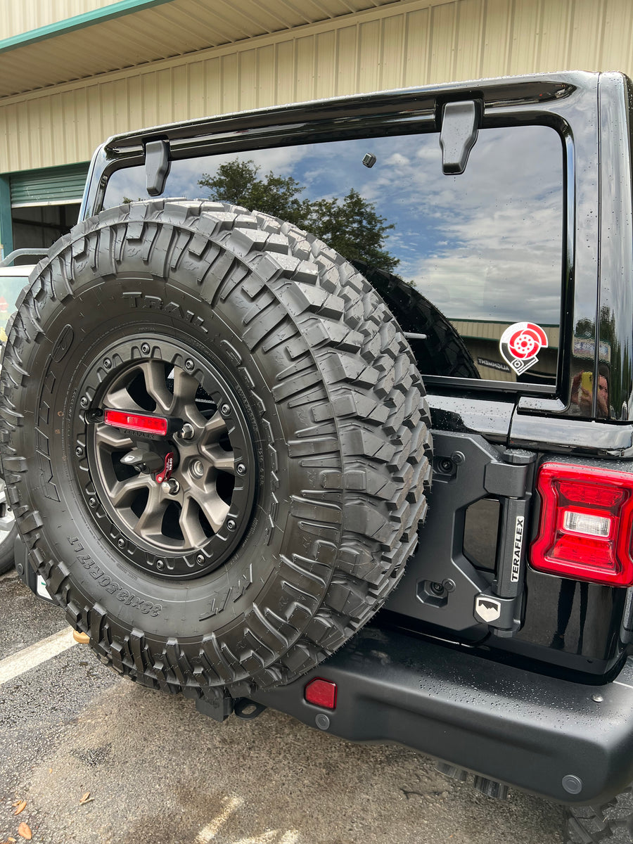 Tire carrier for online jeep wrangler